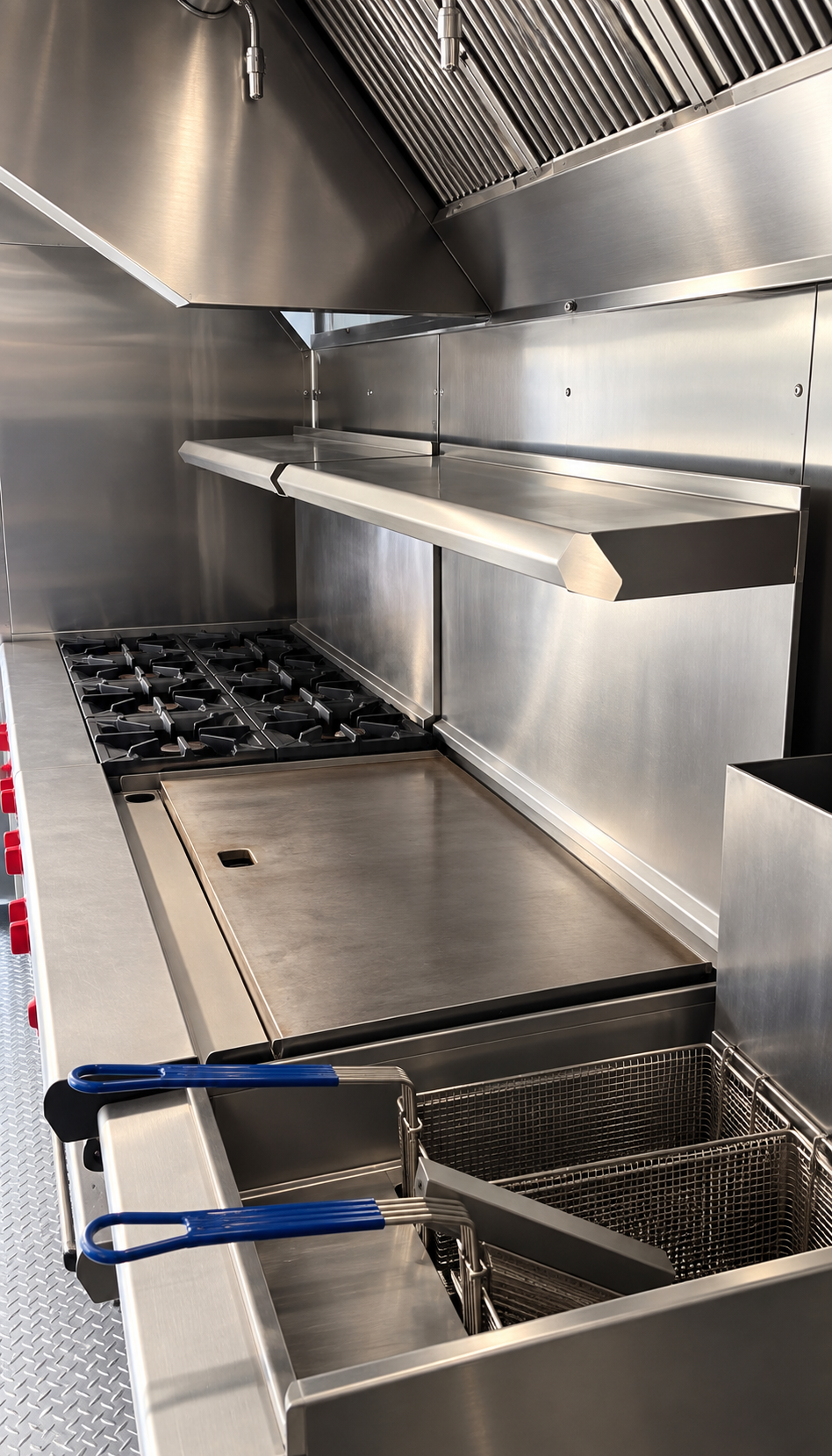 Stainless steel cooking line and preparation space inside a mobile kitchen